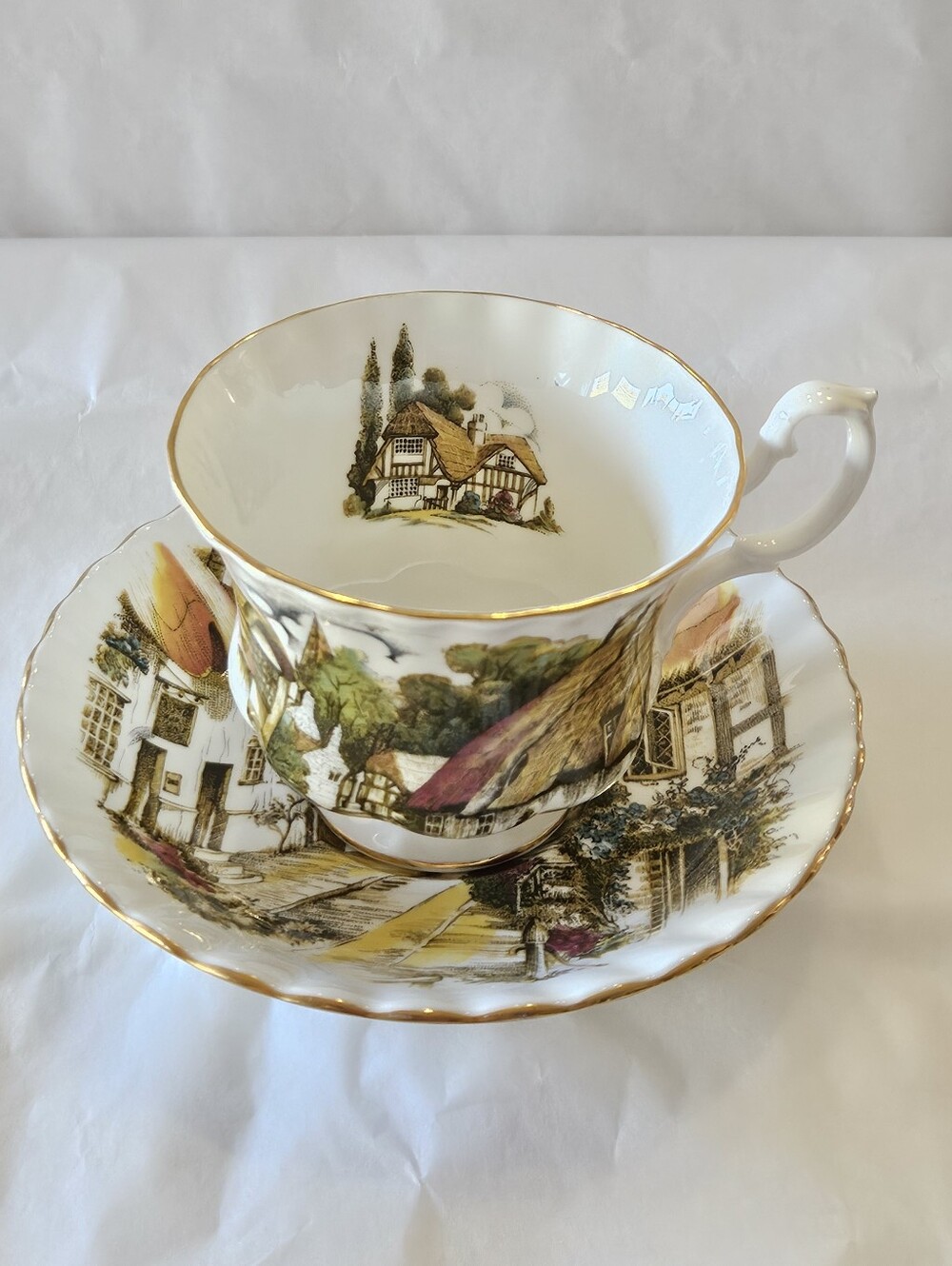 "Country Scenes" cup and saucer by Royal Albert.